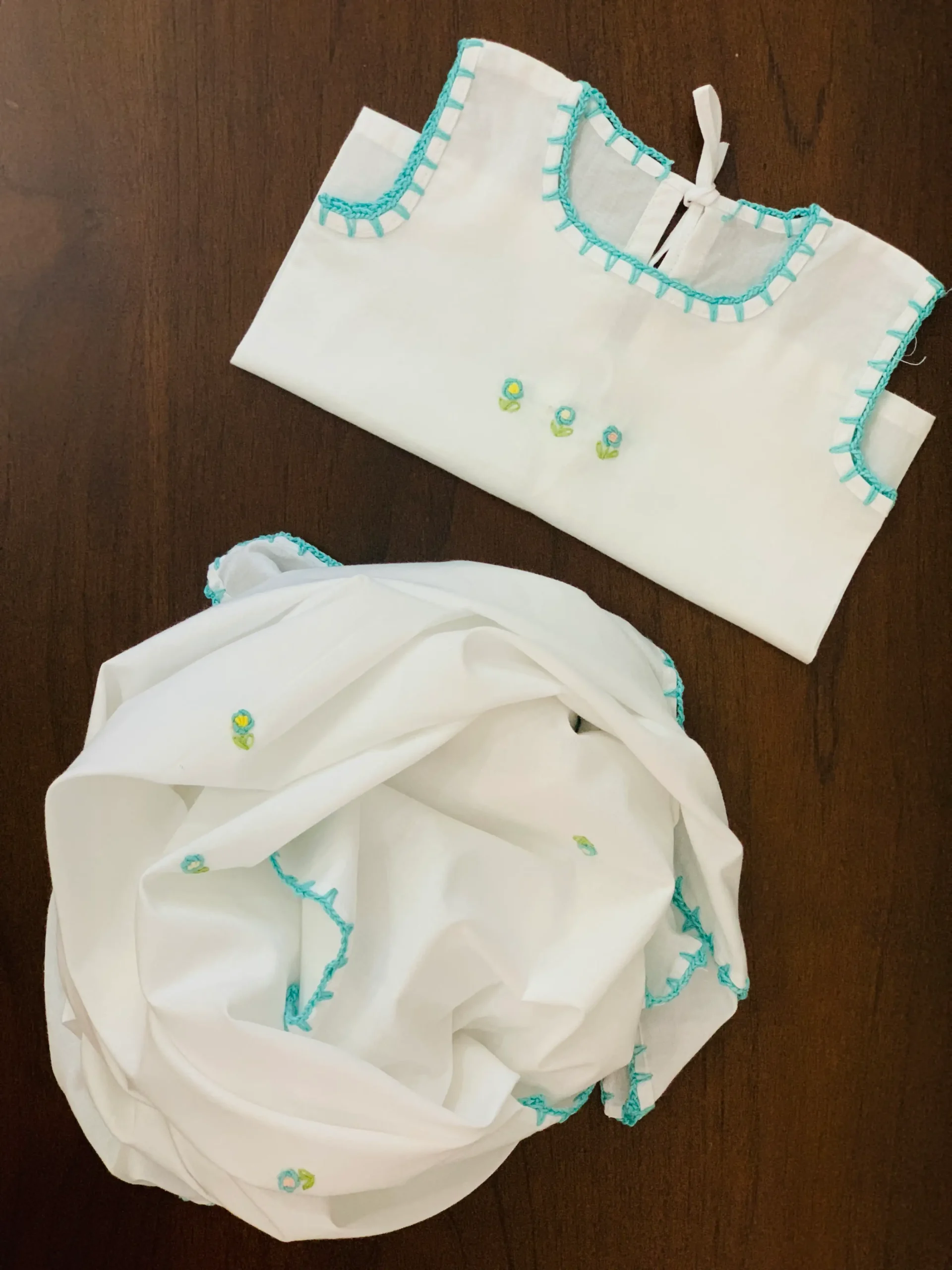 handmade newborn baby attire with blue bullion roses